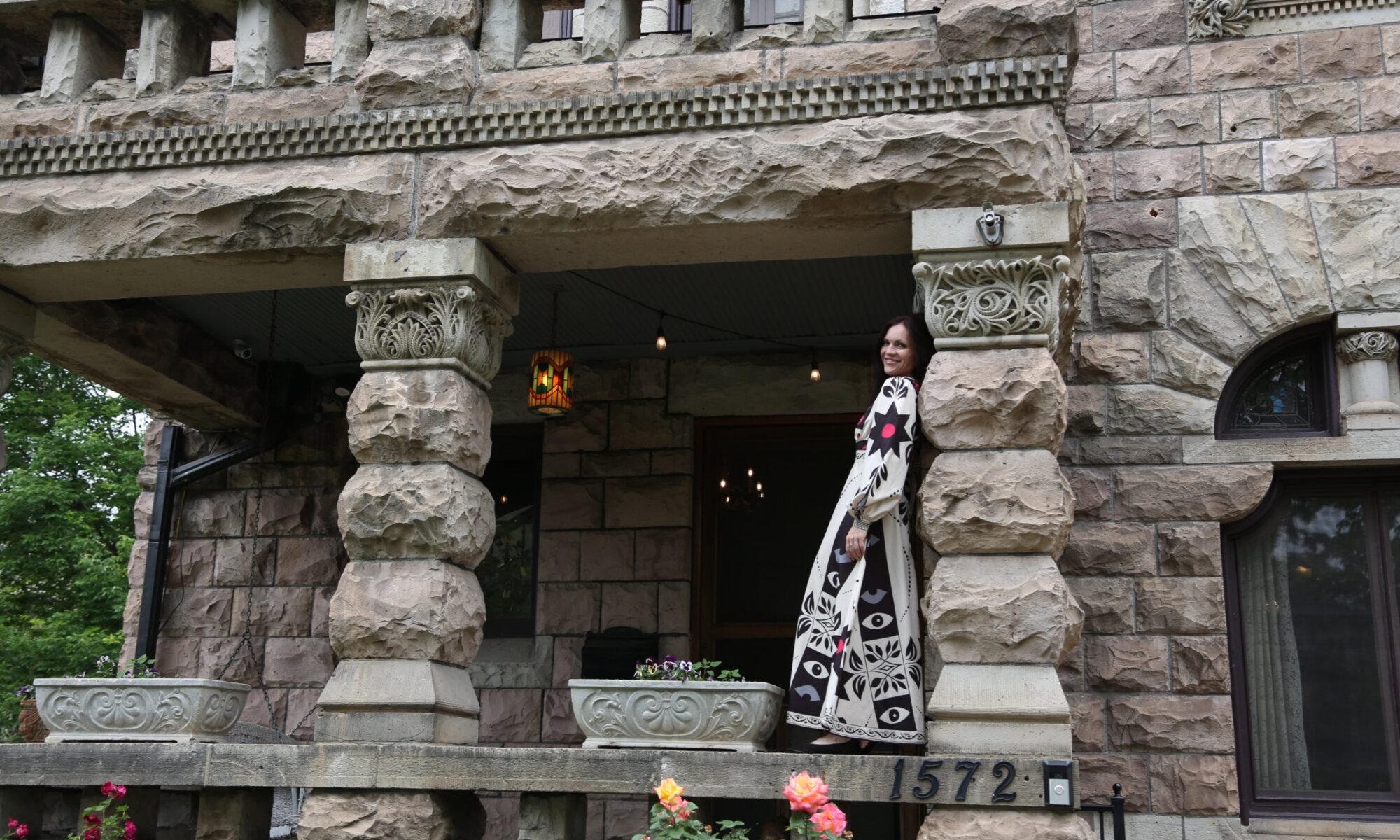 Jessica Abegg on the front porch of Castle Marne, the 1889 Denver landmark she co-owns